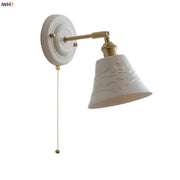 White and gold copper ceramic led wall lamp featuring a textured bell-shaped shade with brass accents for living room