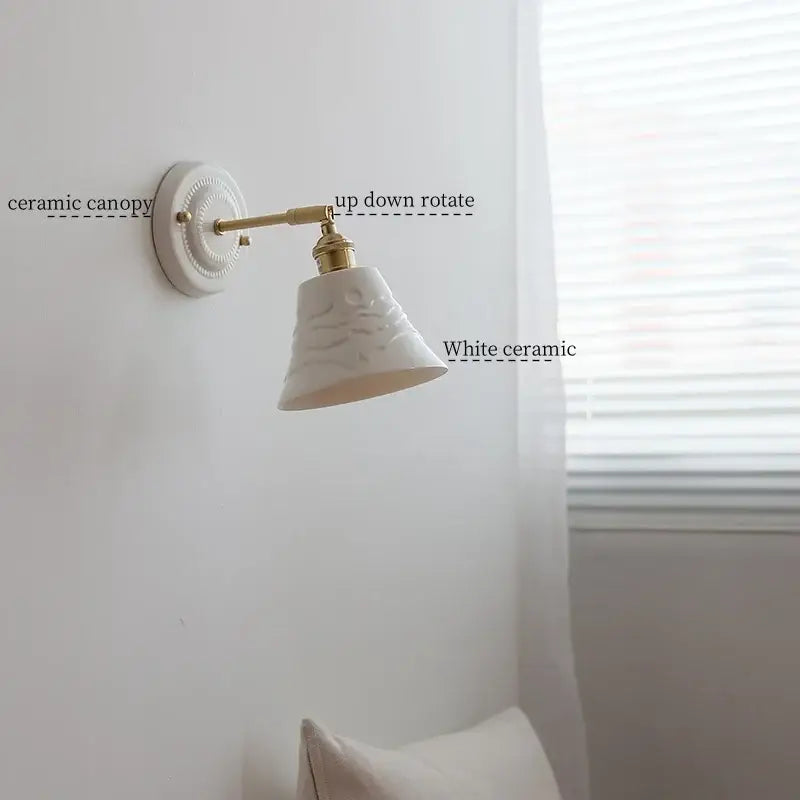 White and gold copper ceramic led wall lamp with embossed details and adjustable arm for living room wall lighting