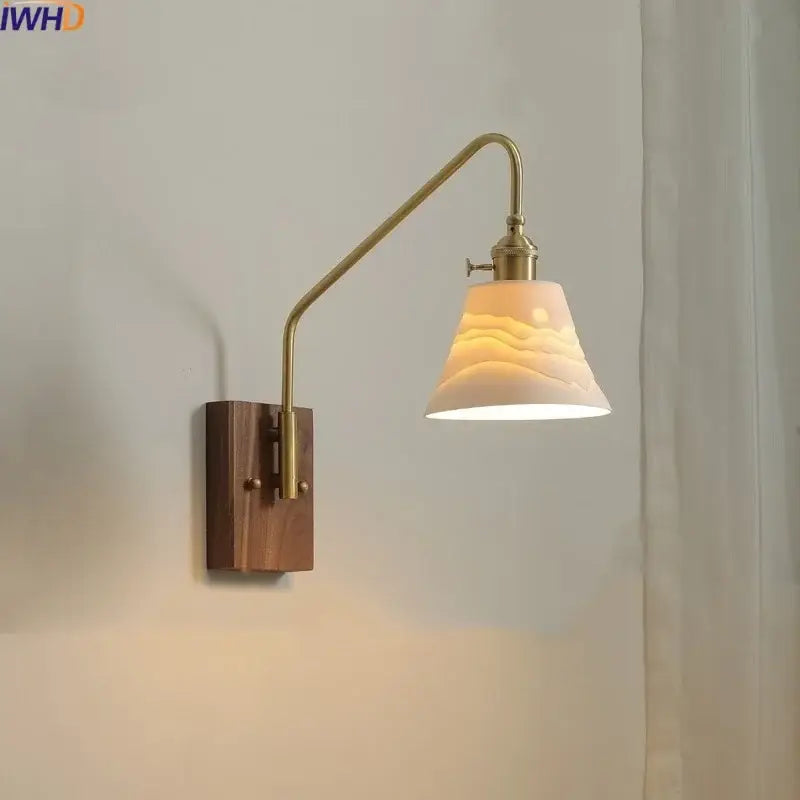Modern brass and copper ceramic led wall lamp with wooden base and off-white wave-patterned ceramic shade for bedroom