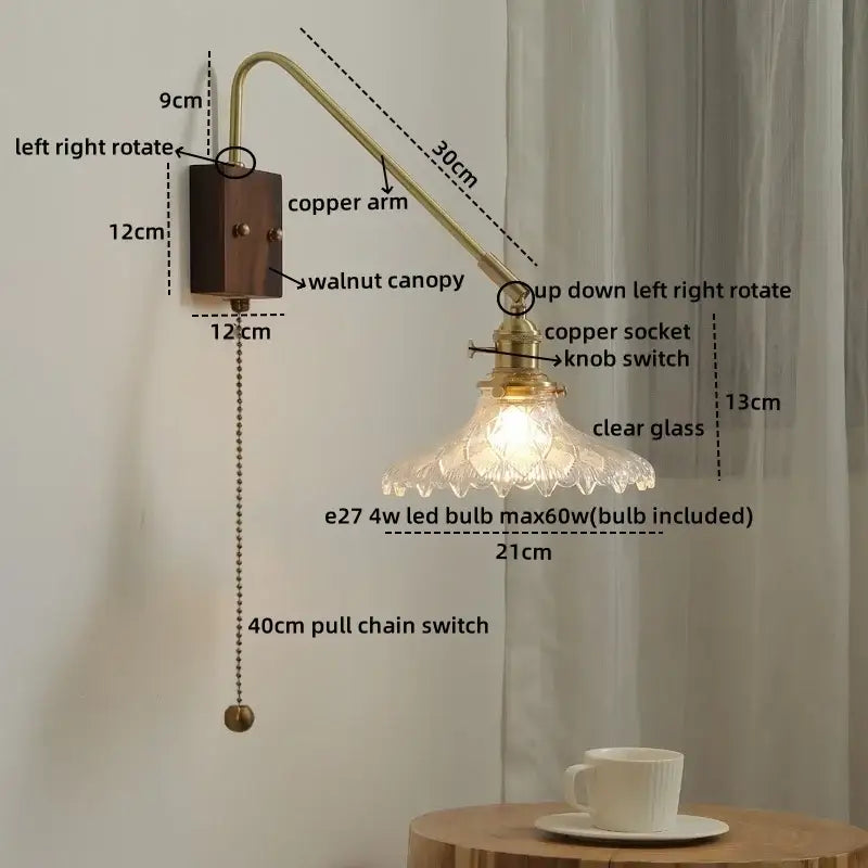 Modern brass and copper ceramic led wall lamp with walnut base and clear glass shade featuring intricate cut patterns