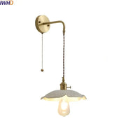 Vintage brass and ceramic led wall light bedroom sconce with textured off-white glass shade and twisted cord
