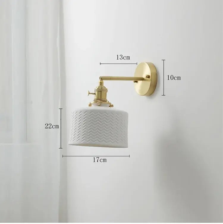 Vintage brass and white ceramic led wall sconce with textured chevron pattern and gold-toned metal arm wall light