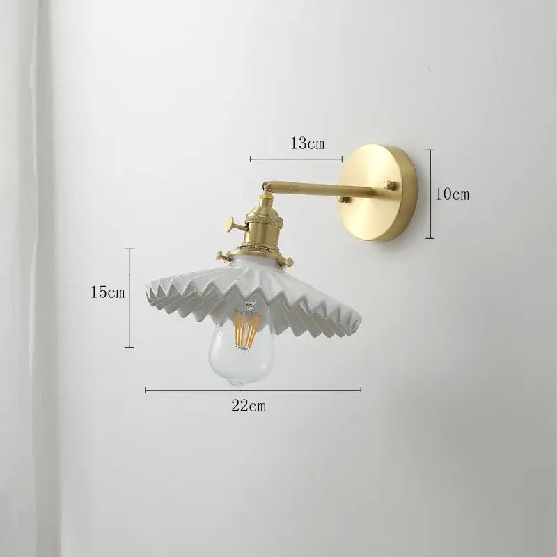 Vintage brass and ceramic led wall sconce with ornate white ceramic shade and pull chain for bedroom wall light