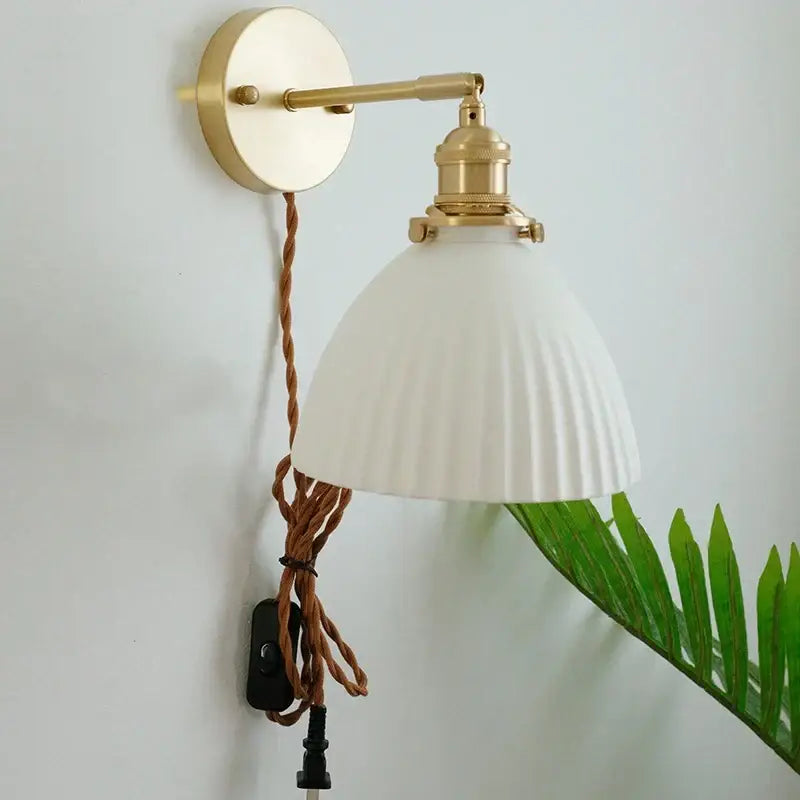 Vintage brass and ceramic led wall sconce with white ribbed glass shade and twisted brown cord wall light for bedroom