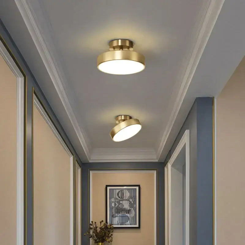 Two modern brass-finished recessed ceiling lights complement the decorbites copper chandelier hallway led ceiling lamp
