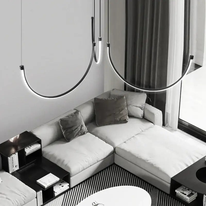 Modern decorbites copper chandelier black led living room light with sleek curved pendant lights above sofa