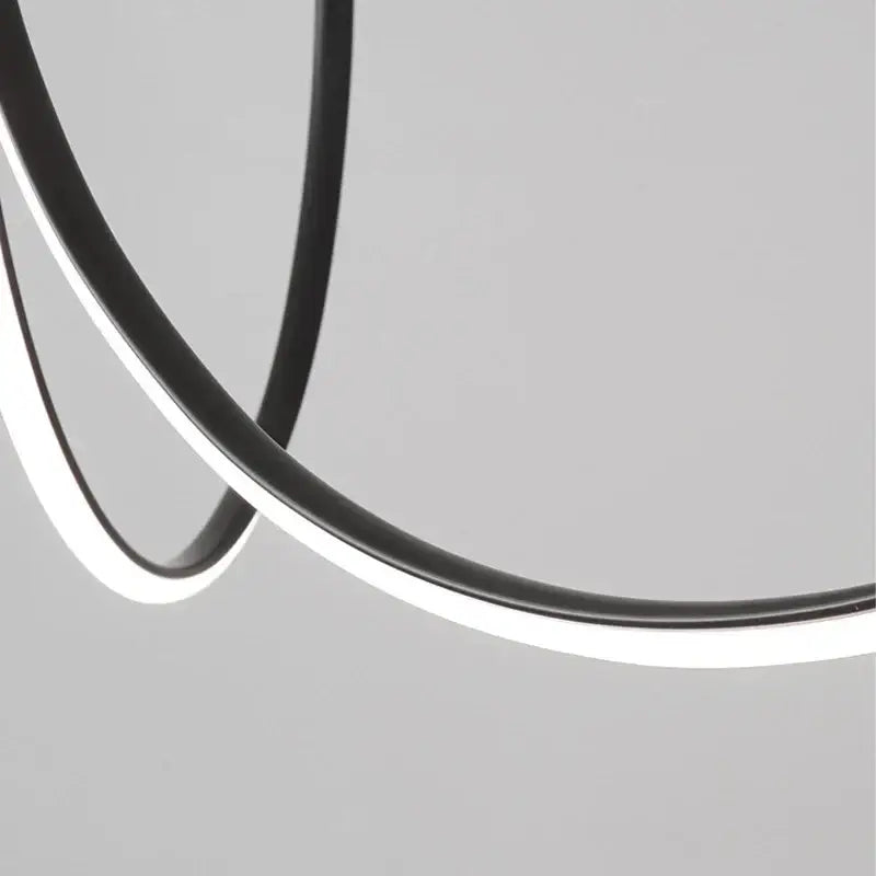 Modern decorbites copper chandelier featuring a black and white circular led light with sleek minimalist design