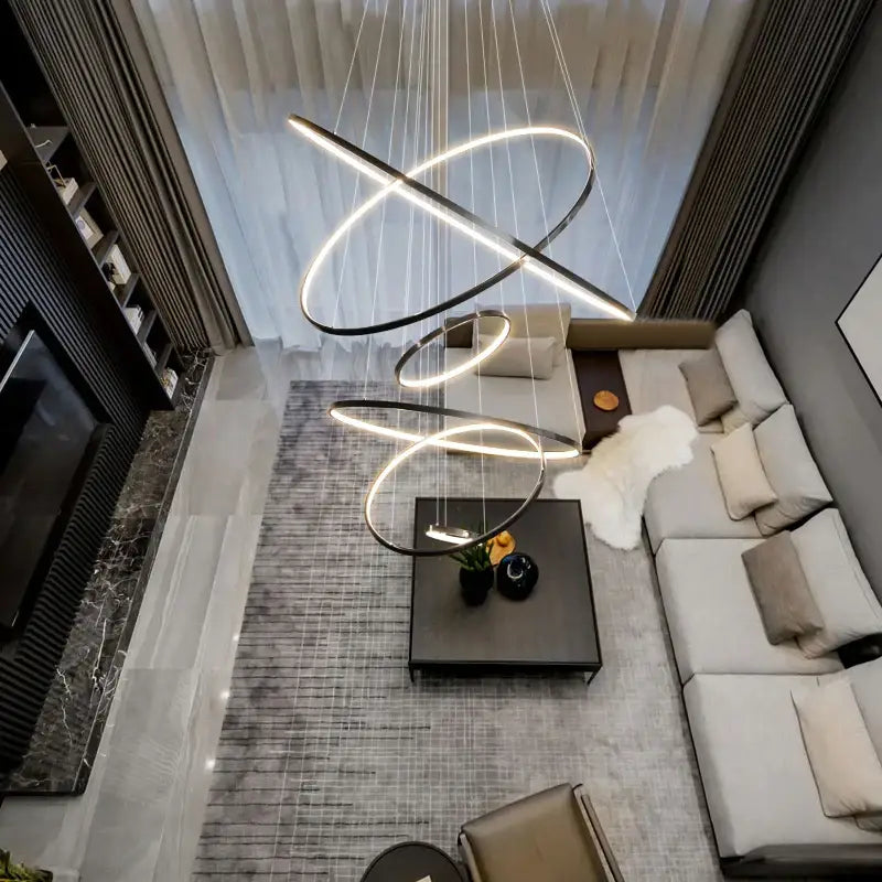 Modern decorbites copper circle chandelier with sleek black and white interlocking LED rings for living room lighting