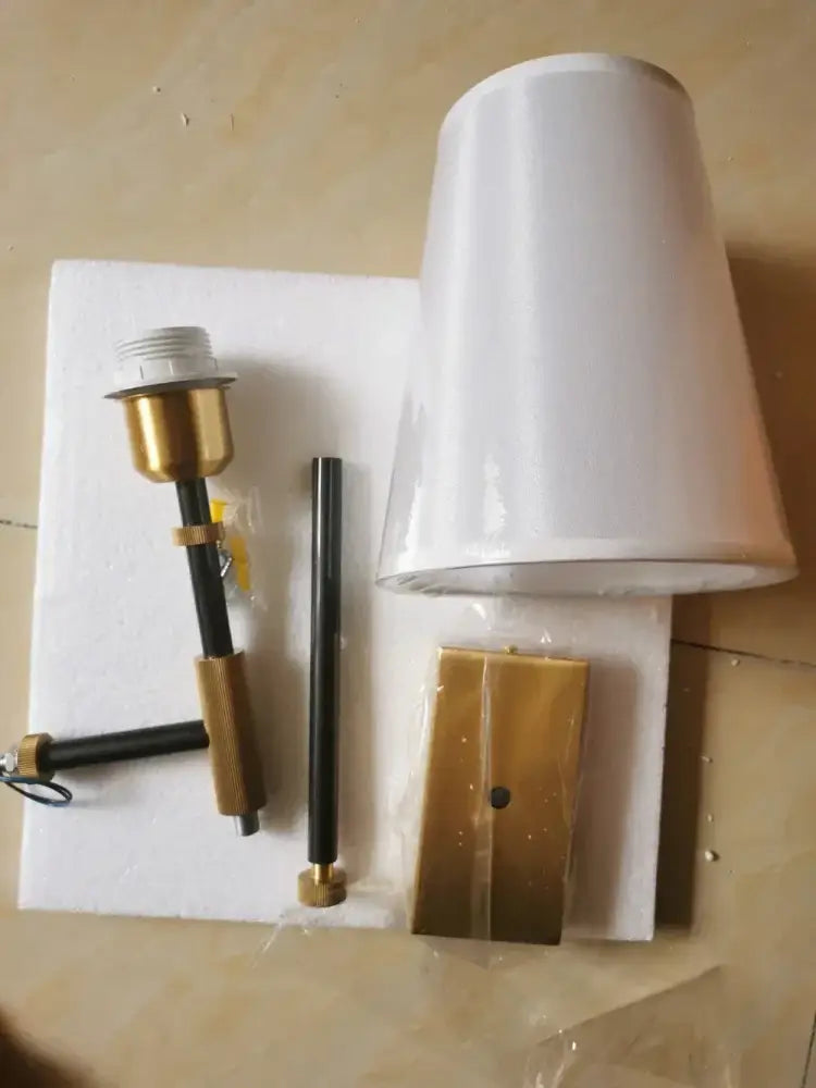 White conical lampshade wall lamp with gold-toned metal bracket and black rod copper cloth led for bedroom use