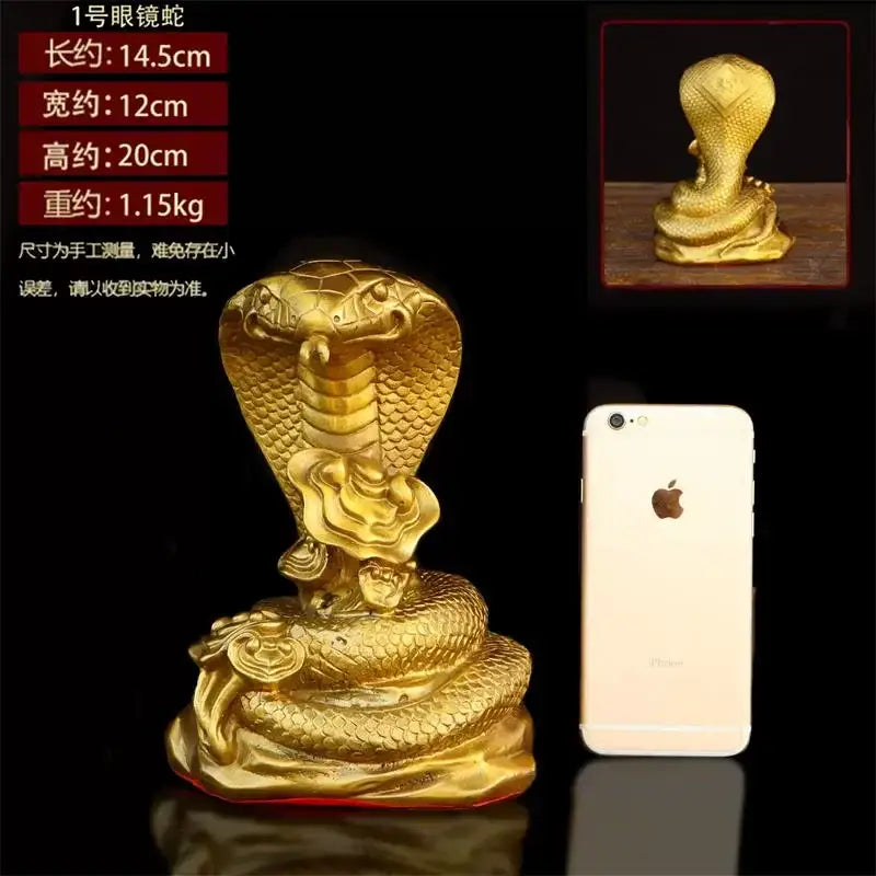 Golden brass cobra zodiac snake statue with detailed scales and raised hood in metallic finish for living room decor