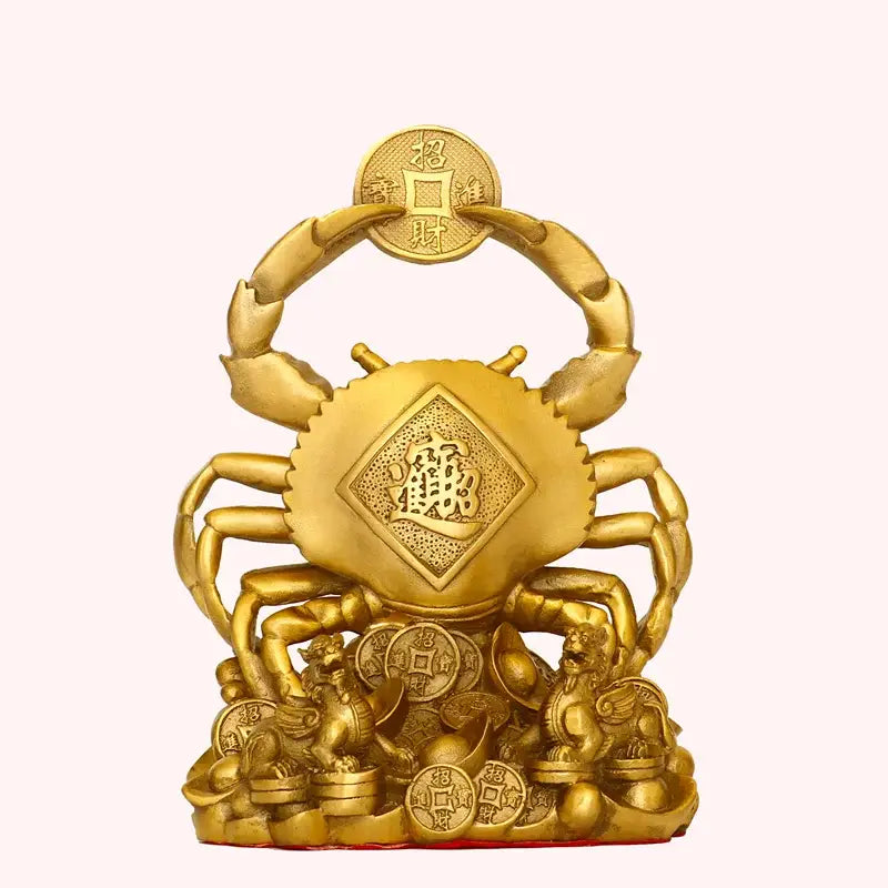 Golden brass copper crab ornament with intricate carvings holding coin surrounded by stacked coins and lion statues for wealth decor