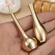 Two polished brass miniature decorbites copper gold tall vases with slender necks and rounded bases for home decor