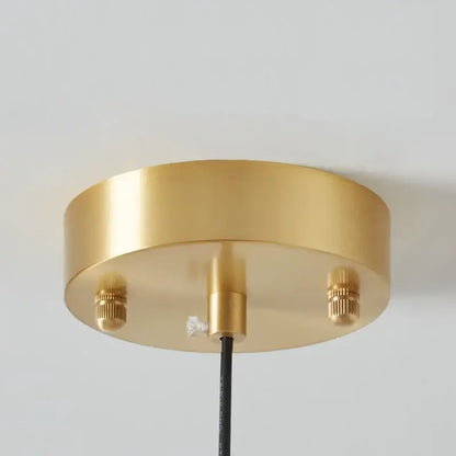 DecorBites™ copper pendant light features a gold-colored circular ceiling fixture with a brushed metal finish and adjustable screws