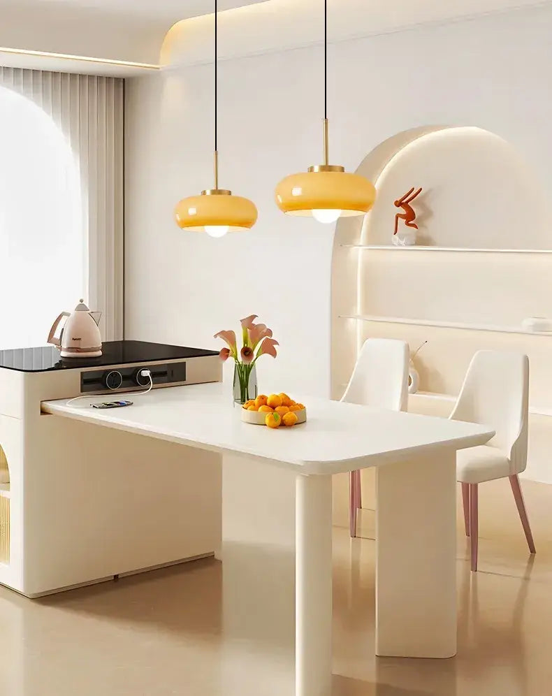 Modern white dining table with sleek minimalist design paired with decorbites copper pendant light fixture
