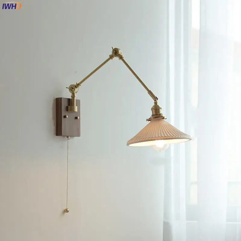 Brass-finished decorbites copper swing arm wall lamp with ribbed off-white glass shade and pull-chain switch for bedroom