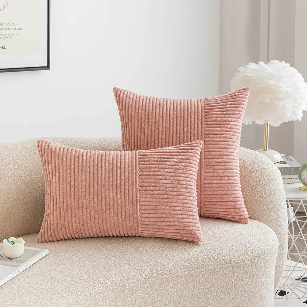 Pink corduroy throw pillows with ribbed texture and two-tone design in decorbites corduroy striped patchwork pillow cover set
