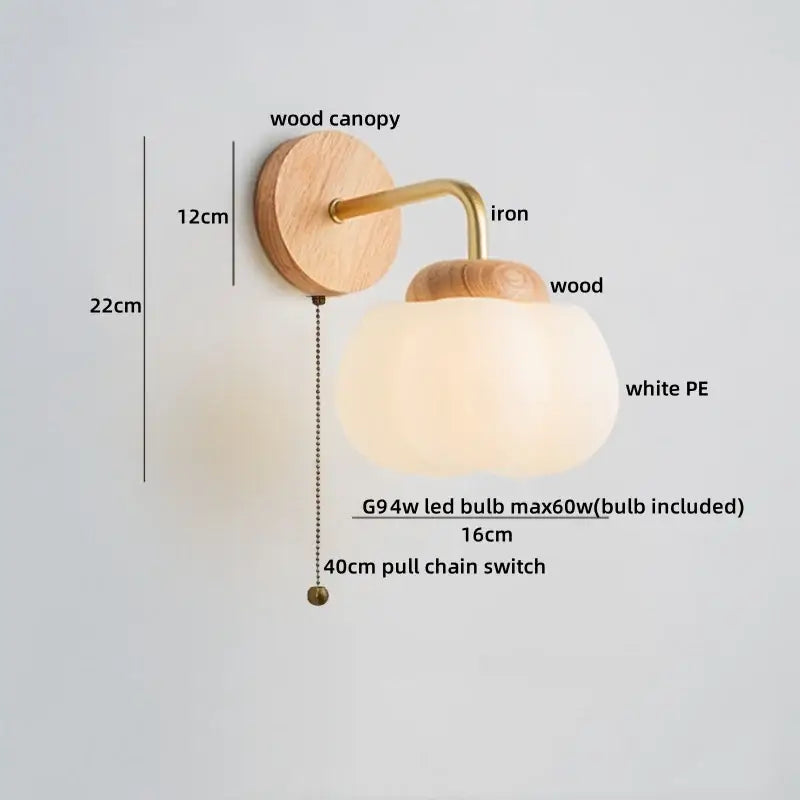 Minimalist decorbites cotton led wall lamp with natural wood canopy, white pe glass globe shade, and brass pull chain switch