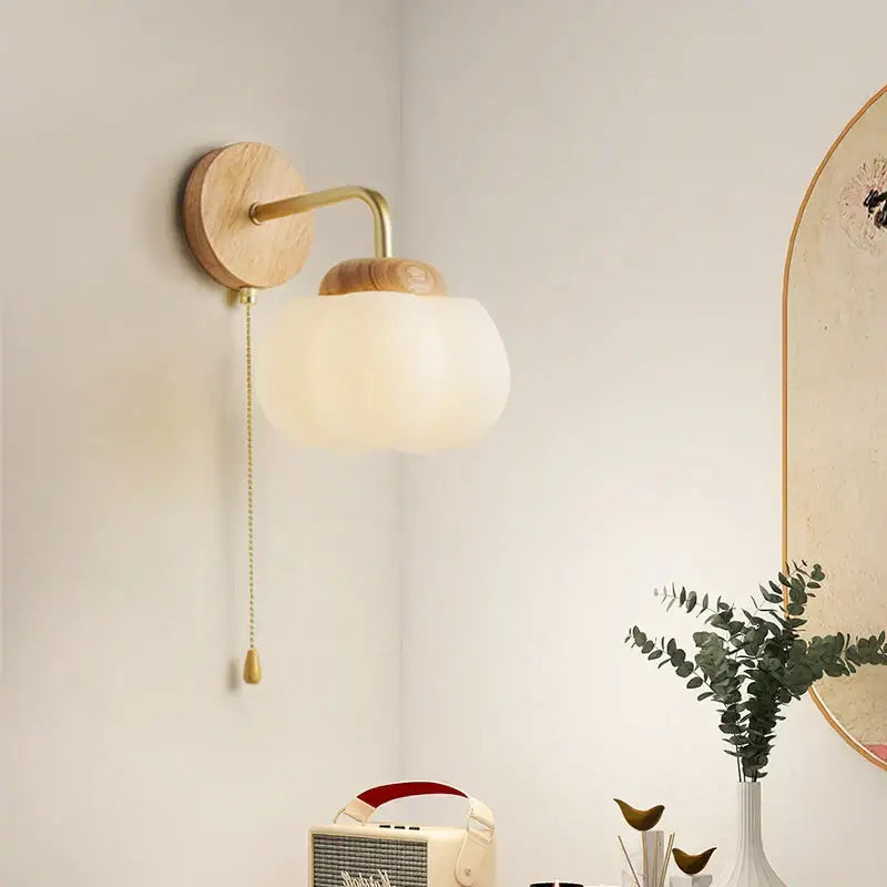 Minimalist decorbites cotton led wall lamp with natural wood backplate brass arm and off-white frosted glass globe shade