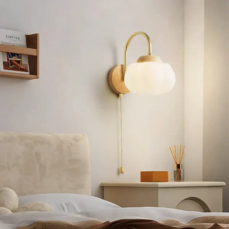 Gold-toned decorbites cotton led wall lamp with frosted glass globe and wooden base for bedroom cloud sconce lighting