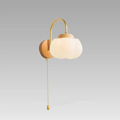 A warm-toned brass and wood wall lamp with a frosted glass cloud shade from decorbites cotton led wall lamps
