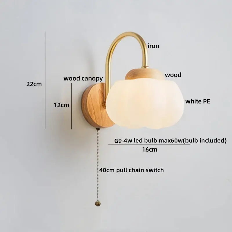 A warm-toned decorbites cotton led wall lamp with brass iron arm, wooden base, and off-white cotton led wall shade