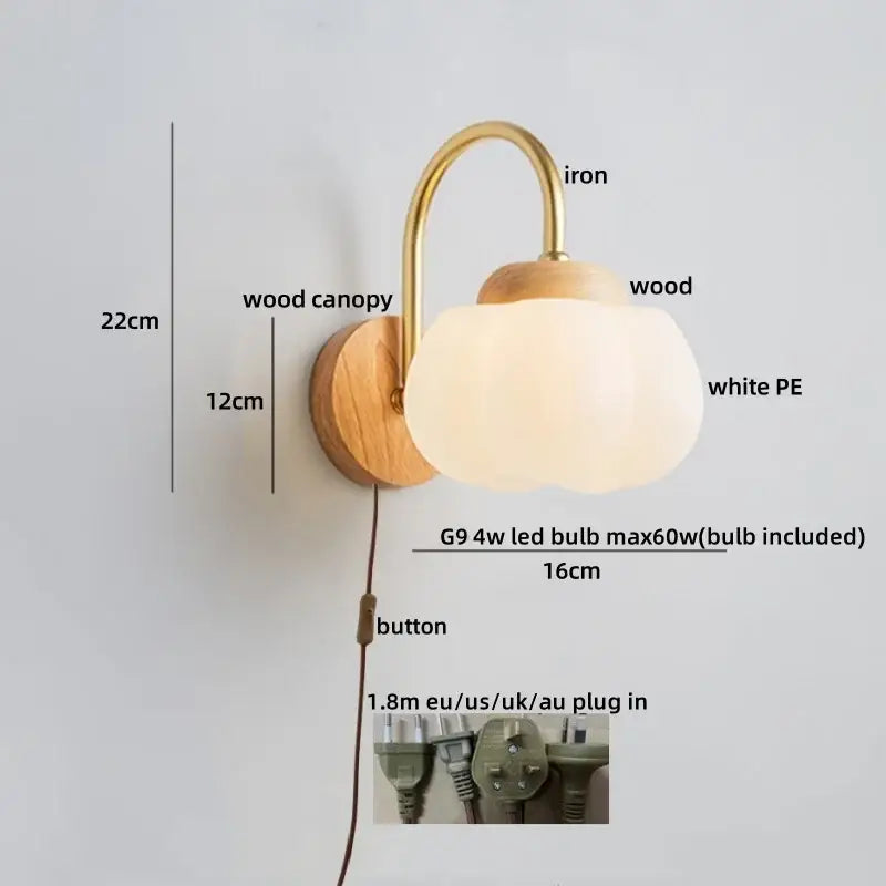 A warm-toned decorbites cotton led wall lamp with brass iron arm wooden base and soft white cotton led wall shade for bedroom