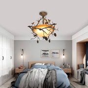 Antique bronze-finished decorbites™ country bronze 3-light bowl semi flush with amber glass shade and bird design