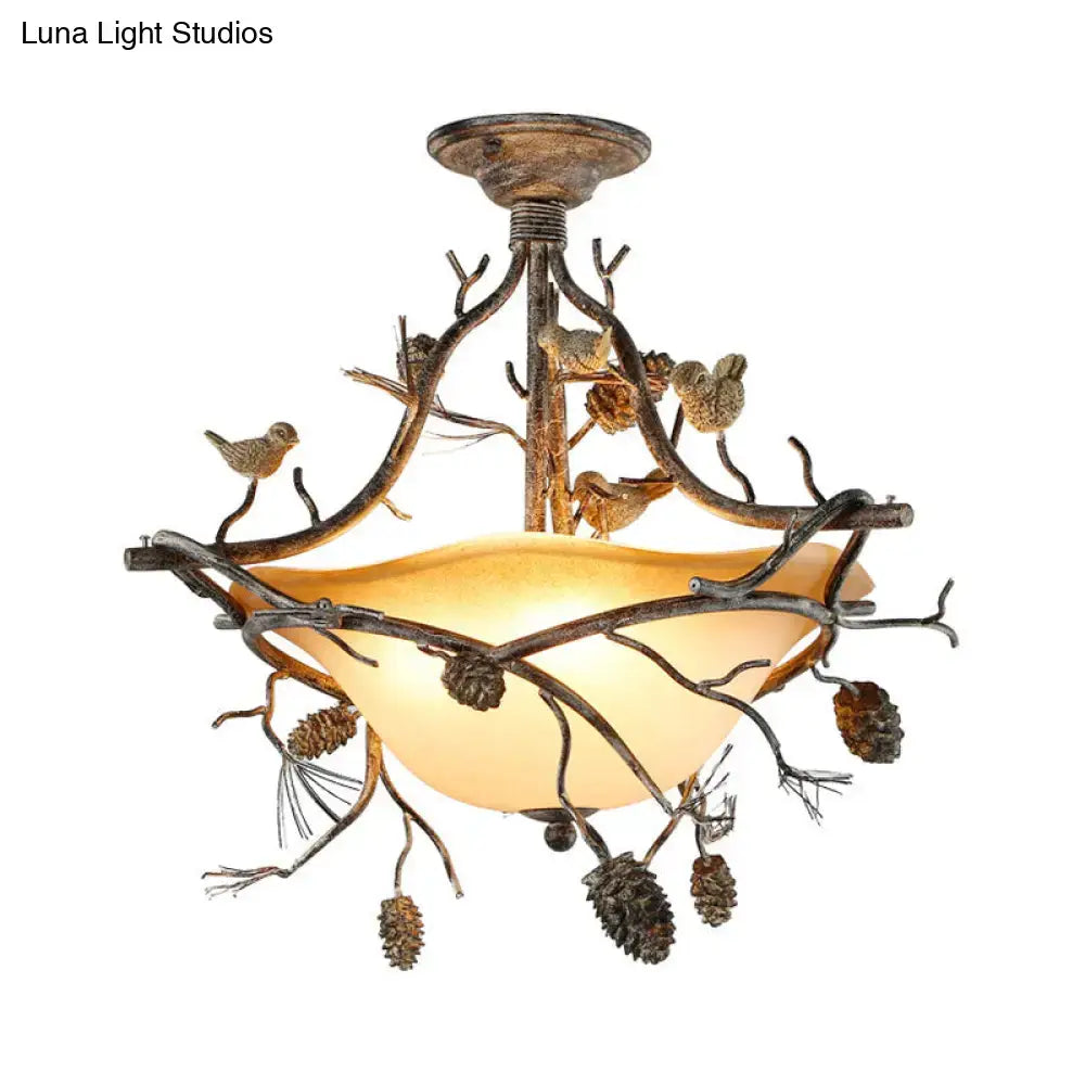 Rustic bronze-finished metal bowl semi flush chandelier with amber glass shade and bird details for bedroom lighting