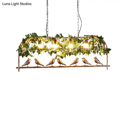 A bronze birdcage island light fixture with six detailed birds and faux ivy for rustic bar suspension lighting