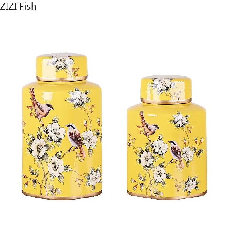 Vibrant yellow decorbites country ceramic tea caddies with hand-painted white blossoms and gold-trimmed lids and bases