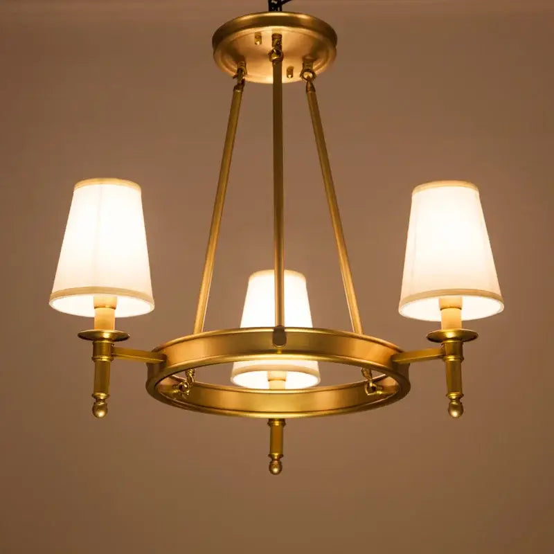 Decorbites country fabric brass chandelier with three warm-toned fabric shades for bedroom lighting