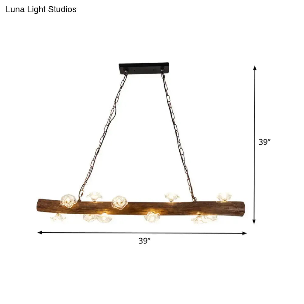 Rustic wooden log mushroom chandelier with clear glass skull accents and black metal chains for indoor pendant lighting