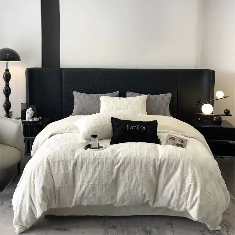Black quilted headboard with sleek modern design complements decorbites cozy faux rabbit fur bedding set black and grey bedroom