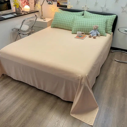 Beige satin bed sheet with smooth flowing drape and tucked edges from decorbites cozy nordic plaid 1pc flat sheet set