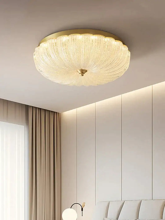 Decorbites cream air ceiling lamp with a gold ribbed glass frame and translucent round design for bedroom lighting