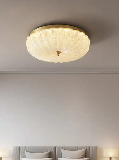 Decorbites cream air ceiling lamp with a gold ribbed frosted glass frame designed for bedroom lighting