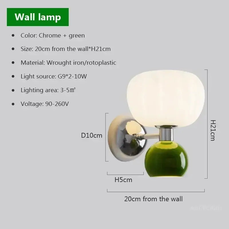 Chrome and green wall lamp with frosted glass globe shade on wrought iron base in decorbites cream breeze sconce
