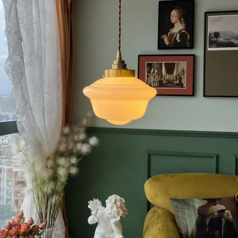 Warm-toned cream glass led pendant light by decorbites with frosted glass and brass fixture for kitchen use