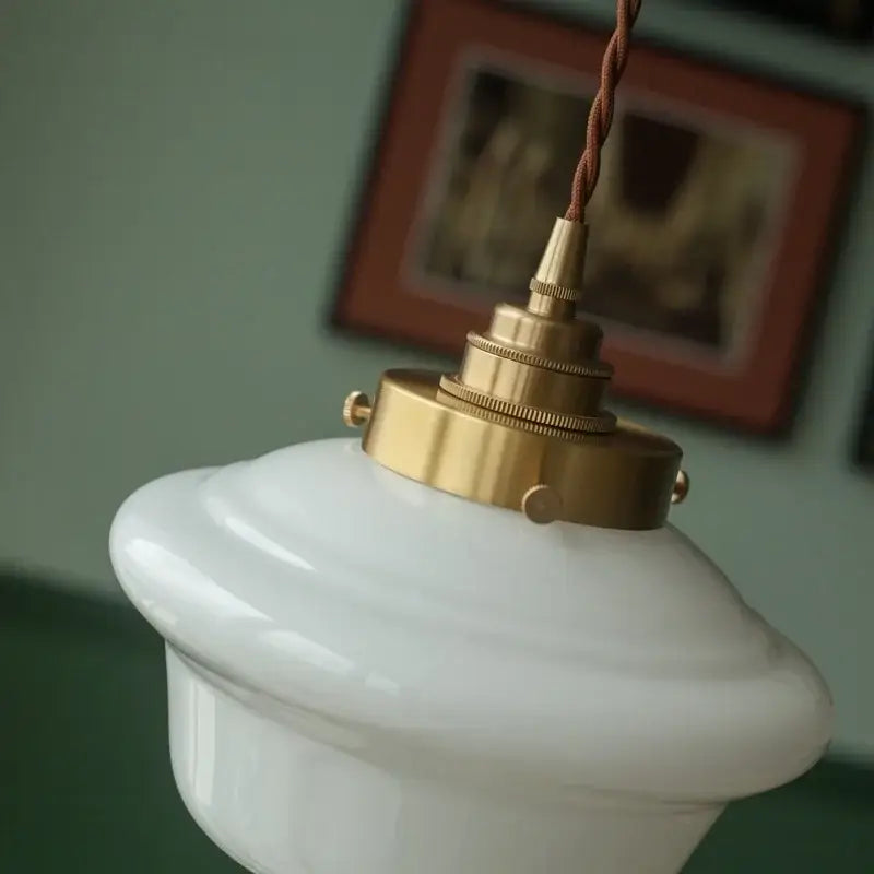Decorbites cream glass led pendant light with white ceramic shade brass fixture and twisted brown cord for kitchen use