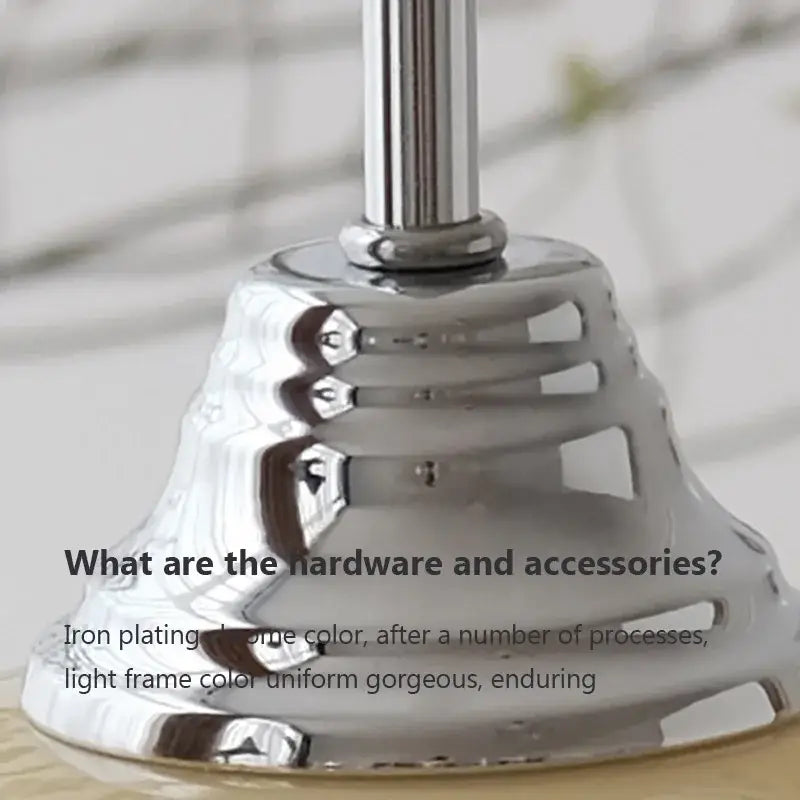 Chrome-plated metal lamp base with sleek bell-shaped design and cutouts for decorbites cream glass pendant light