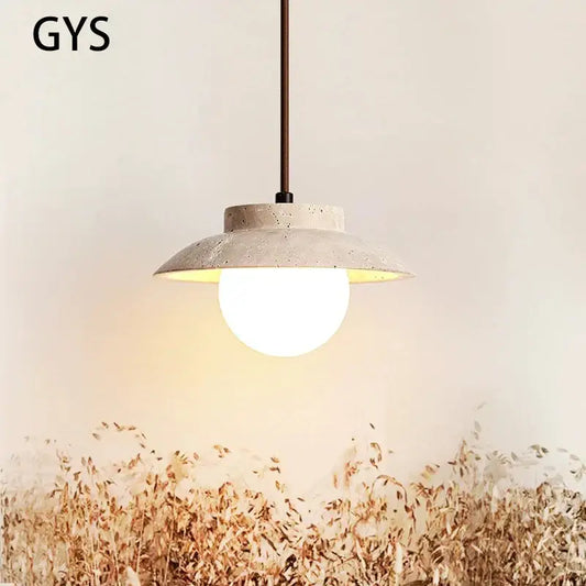 Concrete pendant lamp with matte beige textured shade and warm white bulb from decorbites cream stone chandelier collection
