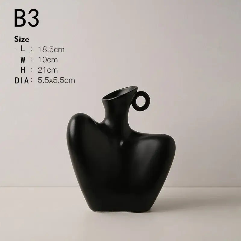 Black ceramic human vase with sleek abstract design and circular handle for modern home decor by DecorBites™