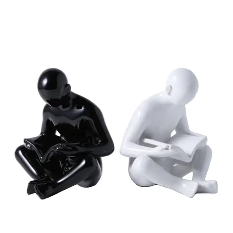 Glossy black and white resin creative ceramics sculpture of abstract human forms reading by decorbites creative ceramics