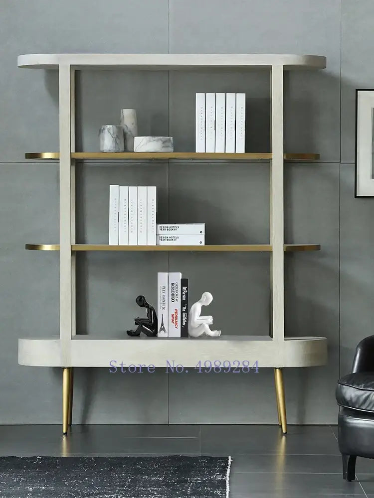 Modern minimalist off-white bookshelf with gold accents featuring clean lines and decorbites creative ceramics sculpture