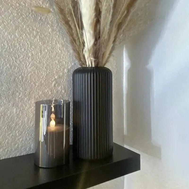 DecorBites™ black ribbed plastic flower vase holding dried pampas grass for elegant floral arrangements