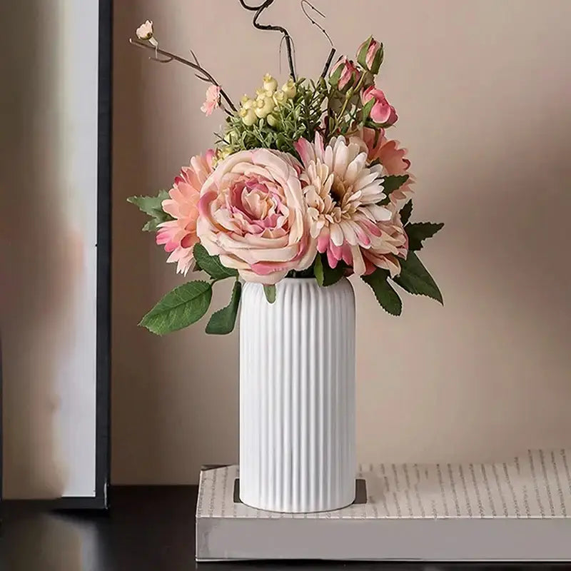 White ribbed ceramic flower vase holding pink and cream artificial floral arrangements for decorbites plastic flower vase