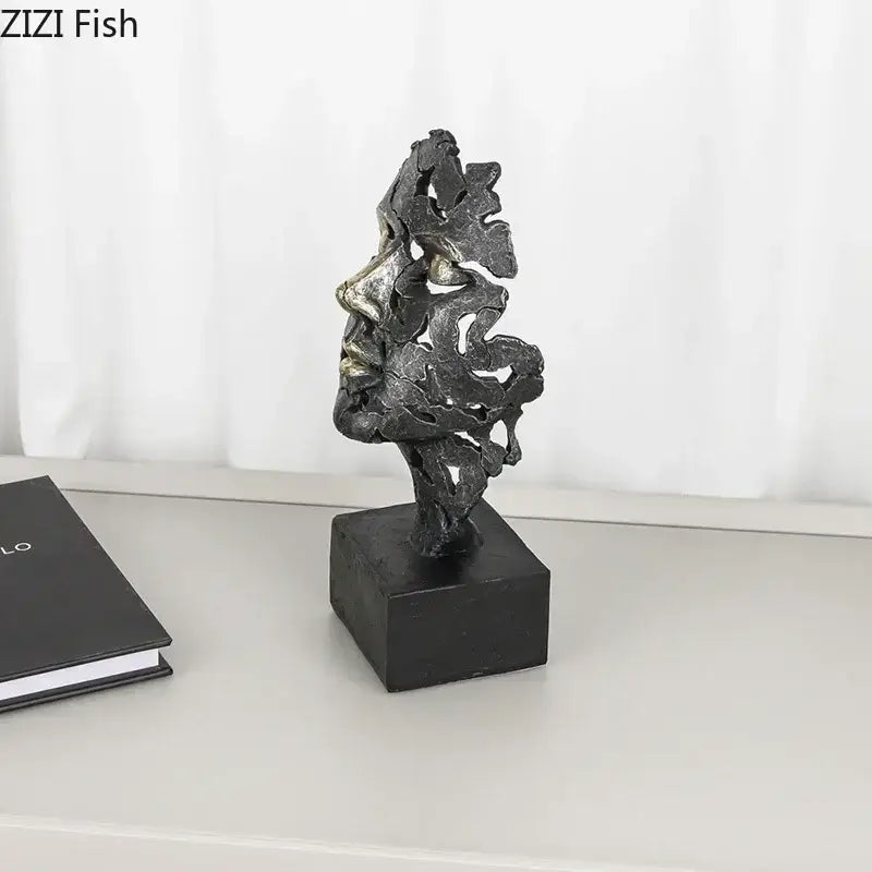 Abstract metallic face sculpture with intricate leaf patterns in dark gray and silver tones for decorbites creative thinker desk decor