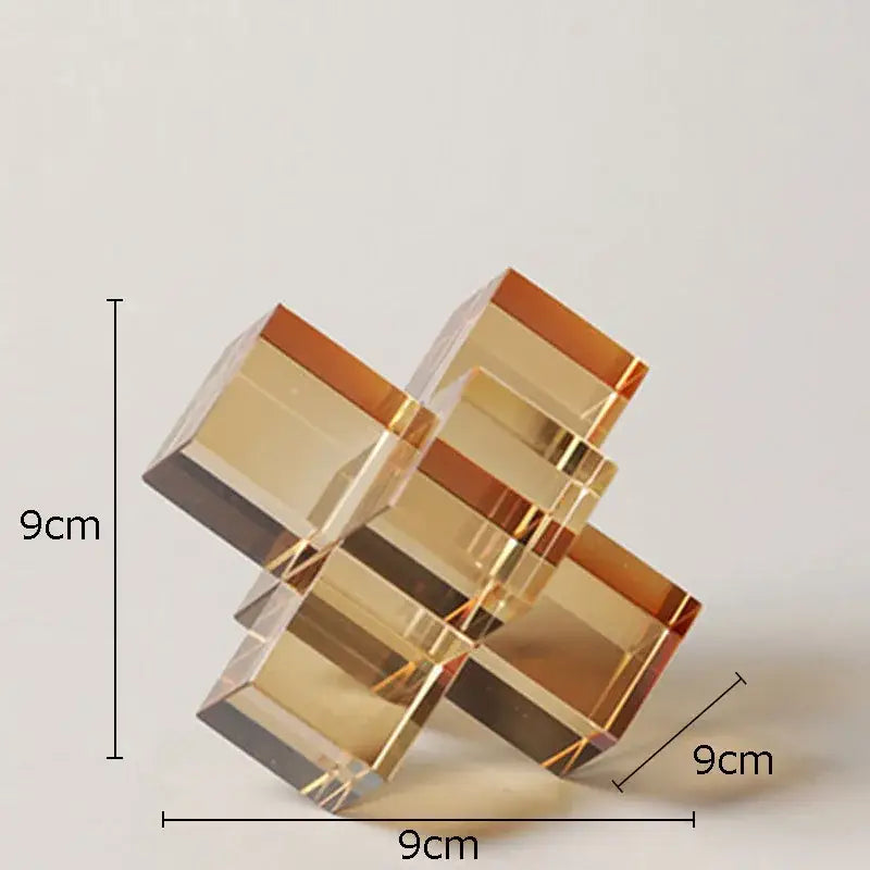 A geometric decorbites cross crystal sculpture with transparent amber acrylic blocks for living room decor
