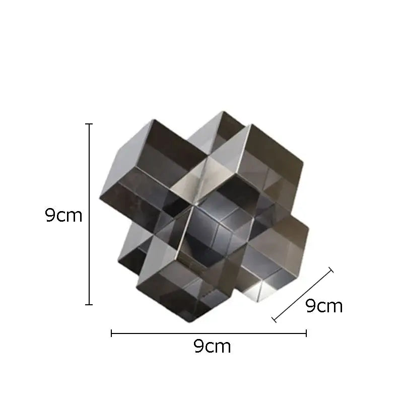 A sleek 9cm cube polished metallic decorbites cross crystal black geometric interlocking sculpture for living room decor