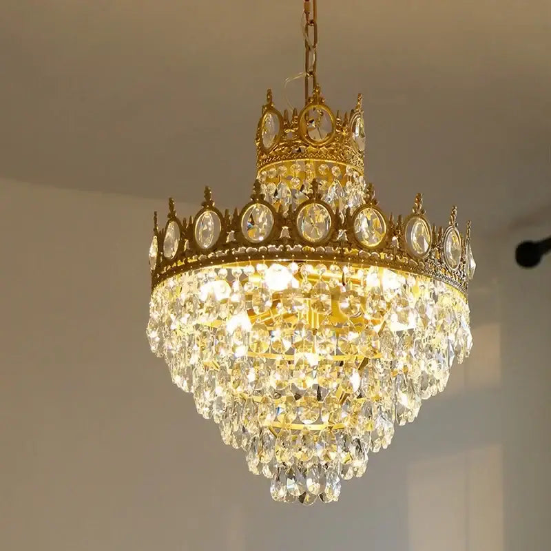 Golden decorbites crown crystal chandelier with cascading clear crystal droplets and circular faceted crystals for bedroom